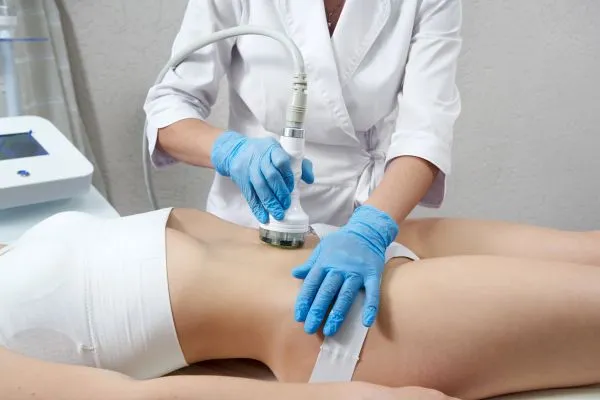 Lost the Weight but Not the Loose Skin? 2 woman having HIFU treatment on her stomach to combat loose skin Tyne and Wear following weight loss